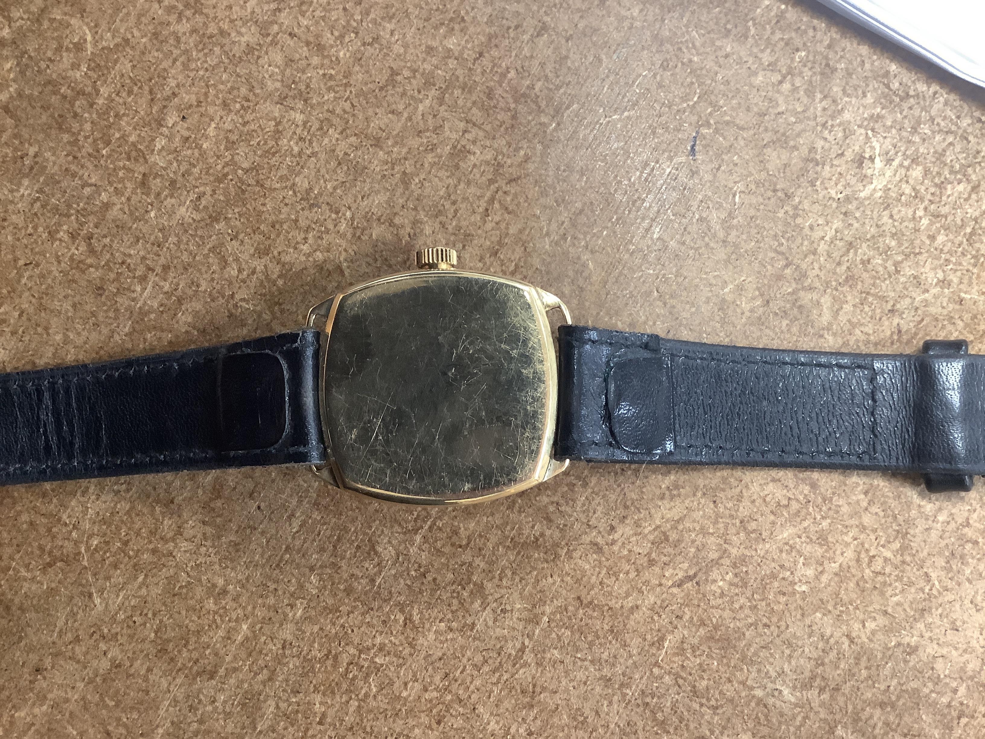 A gentleman's yellow metal J.W. Benson manual wrist watch, with Arabic dial and subsidiary seconds, on a black leather strap.